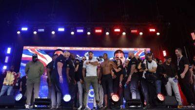 Anthony Joshua - Eddie Hearn - Daniel Dubois - Daniel Dubois, Anthony Joshua weigh in for massive title fight - channelnewsasia.com - Britain - Ukraine