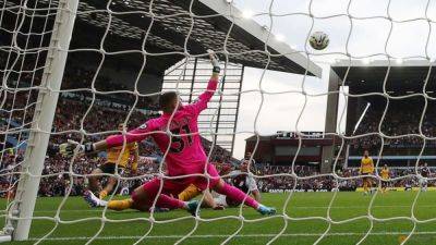 Diego Carlos - Matheus Cunha - Unai Emery - Ollie Watkins - Sam Johnstone - Ezri Konsa - Aston Villa leave it late in 3-1 win to consign Wolves to bottom of table - channelnewsasia.com - county Morgan