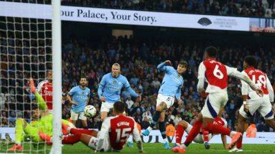 Stones scores deep in injury time as Man City salvage 2-2 draw with Arsenal