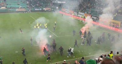 Rapid Vienna vs Austria Vienna derby erupts into chaos as fans clash with fireworks on pitch