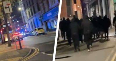 Police step in as football fans 'hurl fireworks' in chaotic scenes in Manchester city centre - manchestereveningnews.co.uk - Netherlands