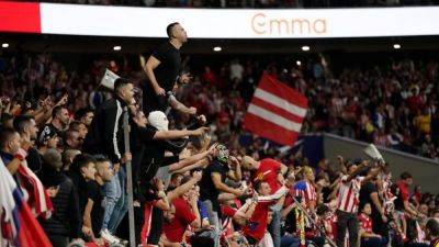 Atletic-Real Madrid derby suspended after fans throw objects onto the pitch