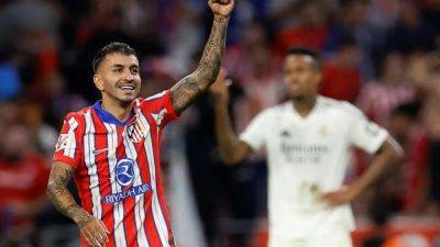 Atletico grab last-gasp equaliser against Real in interrupted Madrid derby