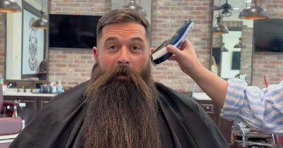 Dad looks '20 years younger' after finally shaving beard he grew for 21 months