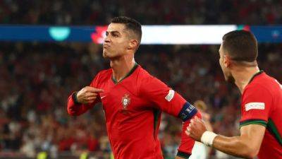 Scott Mactominay - Nuno Mendes - Angus Gunn - Ronaldo strikes late to give Portugal win over Scotland - channelnewsasia.com - Croatia - Portugal - Scotland