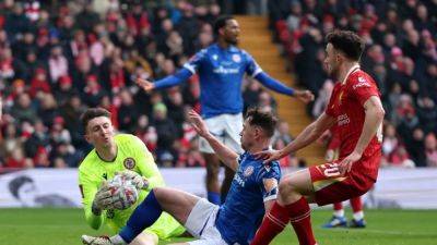 Liverpool march into FA Cup round four, Plymouth stun Brentford