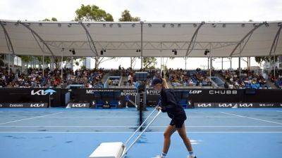 Ponchos at a premium as rain wrecks day one of Australian Open - channelnewsasia.com - Australia - county Park
