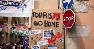 Tourists warned to 'go home' as they're greeted by graffiti in popular Spanish city