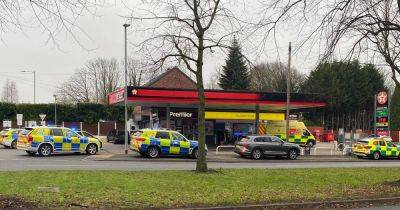 Emergency services called to petrol station after man walks in seriously injured - manchestereveningnews.co.uk