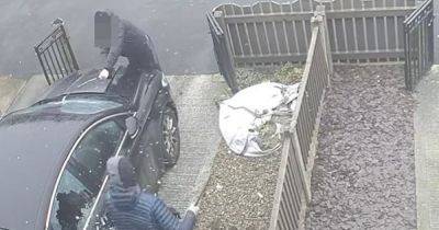 Manhunt continues after house and car 'smashed up' by thugs while children screamed inside