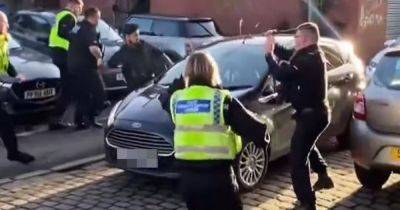 Police officers hit and smash car windows to stop 'dangerous' driver
