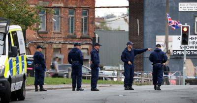 LIVE: Major police scene on Salford street after shooting with bullet holes in window - updates