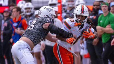 Miami football staffer avoids disaster after Hurricanes player barrels over her