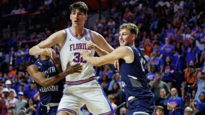 Gators' Rioux becomes tallest to play in college basketball game - ESPN