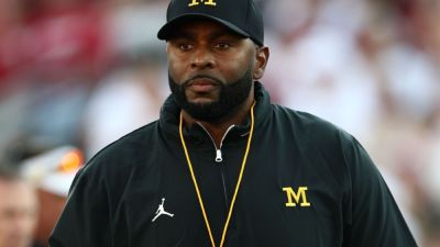 Fired Michigan coach Sherrone Moore in custody; no decision on charges - ESPN