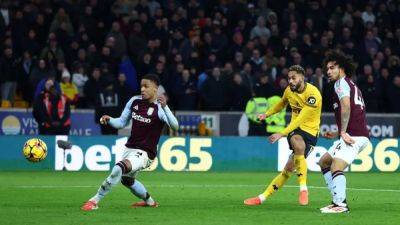 Matheus Cunha - Emiliano Martinez - Unai Emery - Ollie Watkins - Vitor Pereira - Pablo Sarabia - Wolves move out of the drop zone after beating Villa 2-0 - channelnewsasia.com - county Midland