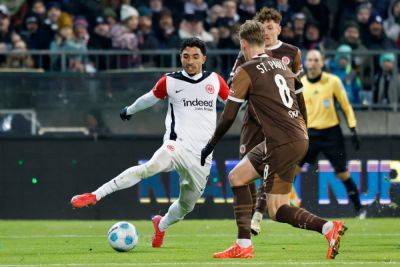 Hugo Ekitike - Kevin Trapp - Bundesliga - Frankfurt cruise past Kiel to tighten grip on third in Bundesliga - guardian.ng - Germany