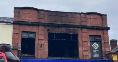 LIVE: Police cordon off flats as man found dead after fire breaks out
