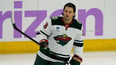 Gary Bettman - Tim Stutzle - Winnipeg Jets - Commish Gary Bettman cuts ban of Wild's Ryan Hartman to 8 - ESPN - espn.com - state Minnesota