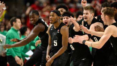 Holloman's half-court heave lifts Michigan State over Maryland - ESPN