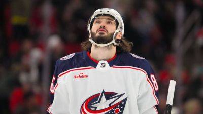 Blue Jackets' Kirill Marchenko hit by puck, suffers broken jaw - ESPN