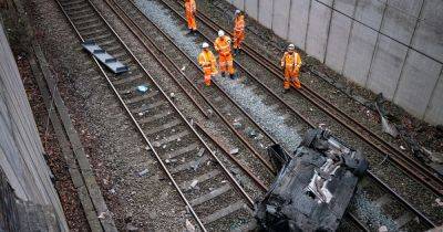 'Drink-driver' causes mayhem after smashing through railway bridge onto tracks - manchestereveningnews.co.uk
