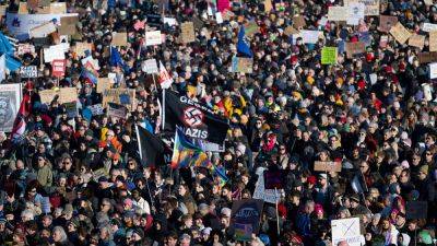 Thousands protest across Germany against far-right extremism ahead of snap elections