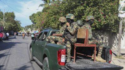 Haiti police vow to ramp up fight against gangs after fresh attacks in the capital