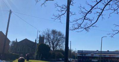 LIVE: Large cordon in place as man on roof of church throws tiles and shouts at police - latest updates - manchestereveningnews.co.uk
