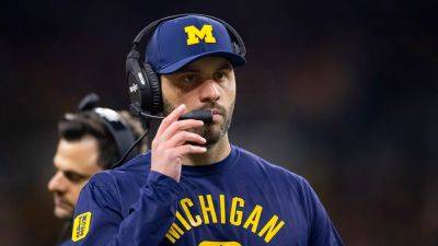 Former Michigan coach pleads not guilty to scheme alleging he hacked info, stole 'intimate' photos