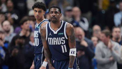 Sources - Mavericks' Kyrie Irving has surgery on torn ACL - ESPN