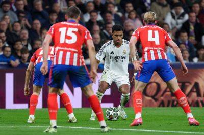 Diaz earns Real Madrid lead on Atletico in Champions League derby clash