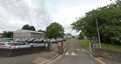 Police called to secondary school as man assaulted and second arrested - live updates