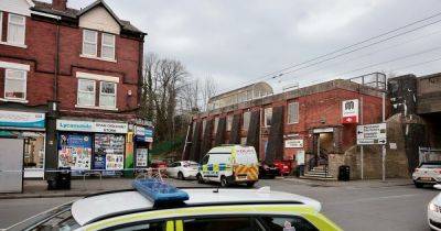 LIVE Police swarm road near train station after stabbing - updates