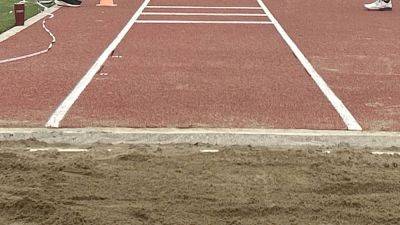 Illinois HS athlete suffers horrific injury while warming up for triple jump