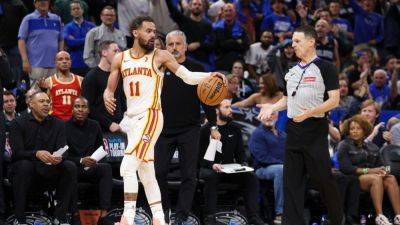Trae Young takes 'frustration' out on refs, gets tossed in loss - ESPN - espn.com - county Daniels