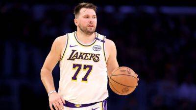 Lakers' Luka Doncic covers cost to restore vandalized Kobe mural - ESPN