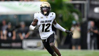 Travis Hunter runs routes for Shedeur Sanders at Buffs event - ESPN