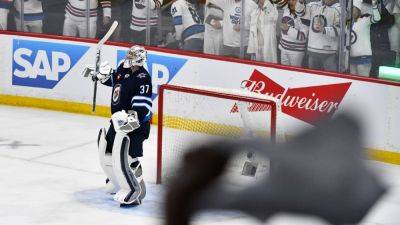 Connor Hellebuyck shuts out Stars in Game 2 as Jets tie series - ESPN