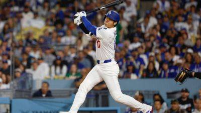 Ohtani marks bobblehead night with 2 HRs in Dodgers rout - ESPN