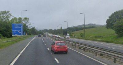 LIVE: M66 queues and major road CLOSED as heavy rain causes flooding - latest updates