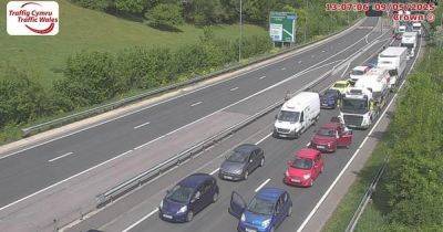 Major road closed in both directions and long delays expected after crash - live updates