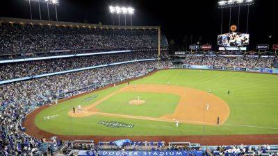 Dodgers place protective netting after concrete slab hits fan - ESPN