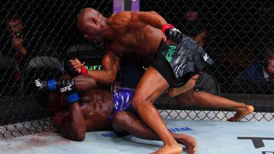 Usman takes down Buckley in UFC main event for 1st win since '21 - ESPN
