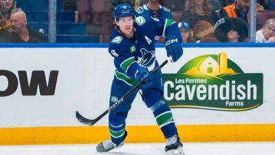 What trade talk? Canucks, Boeser agree on new seven-year deal - ESPN