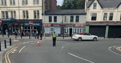Police evacuate shopping centre and supermarkets in Bridgend - live updates