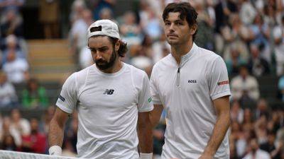 Karen Khachanov - Pete Sampras - Taylor Fritz - Botic Van-De-Zandschulp - John Isner - Fritz reaches Wimbledon quarterfinals after Thompson retires - ESPN - espn.com - Russia - Usa - Australia - Jordan