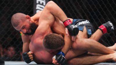 Max Holloway - Kamaru Usman - Robert Whittaker - Chimaev dominates Du Plessis, captures title at UFC 319 - ESPN - espn.com
