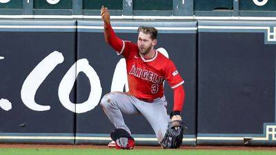 Angels' Taylor Ward carted off after crashing into scoreboard - ESPN