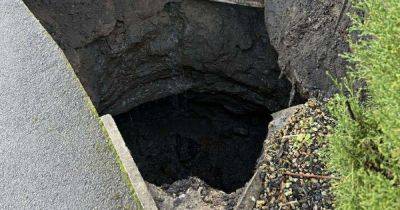 Couple who live next to giant sinkhole that appeared over weekend 'have suitcases packed' - manchestereveningnews.co.uk - county Lane